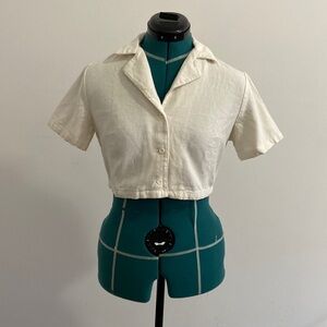 Cream colored cropped button up top with notch collar